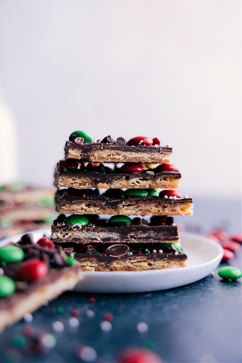A stack of Christmas Crack toffee squares stacked on a plate