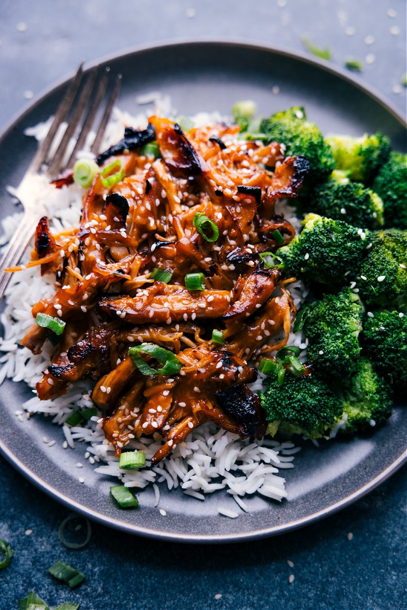 Honey-Garlic Chicken Thighs on a plate, with rice and broccoli.