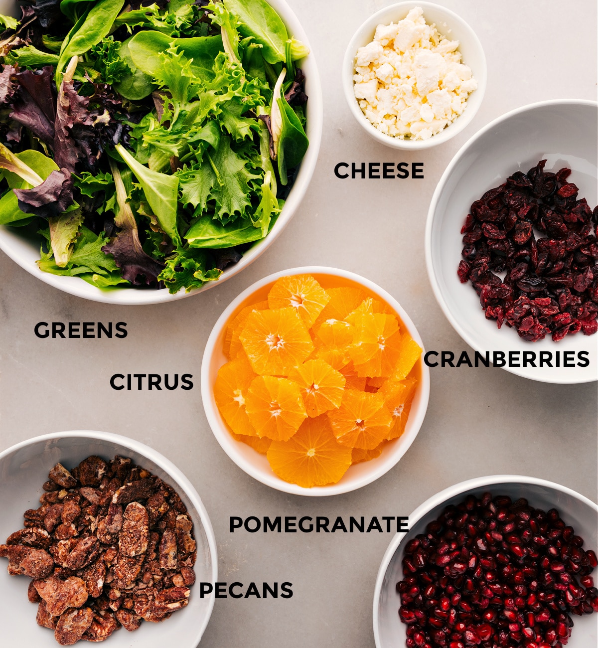 This recipe is prepped for easy assembly with greens, cheese, cranberries, citrus, pomegranate, and pecans.