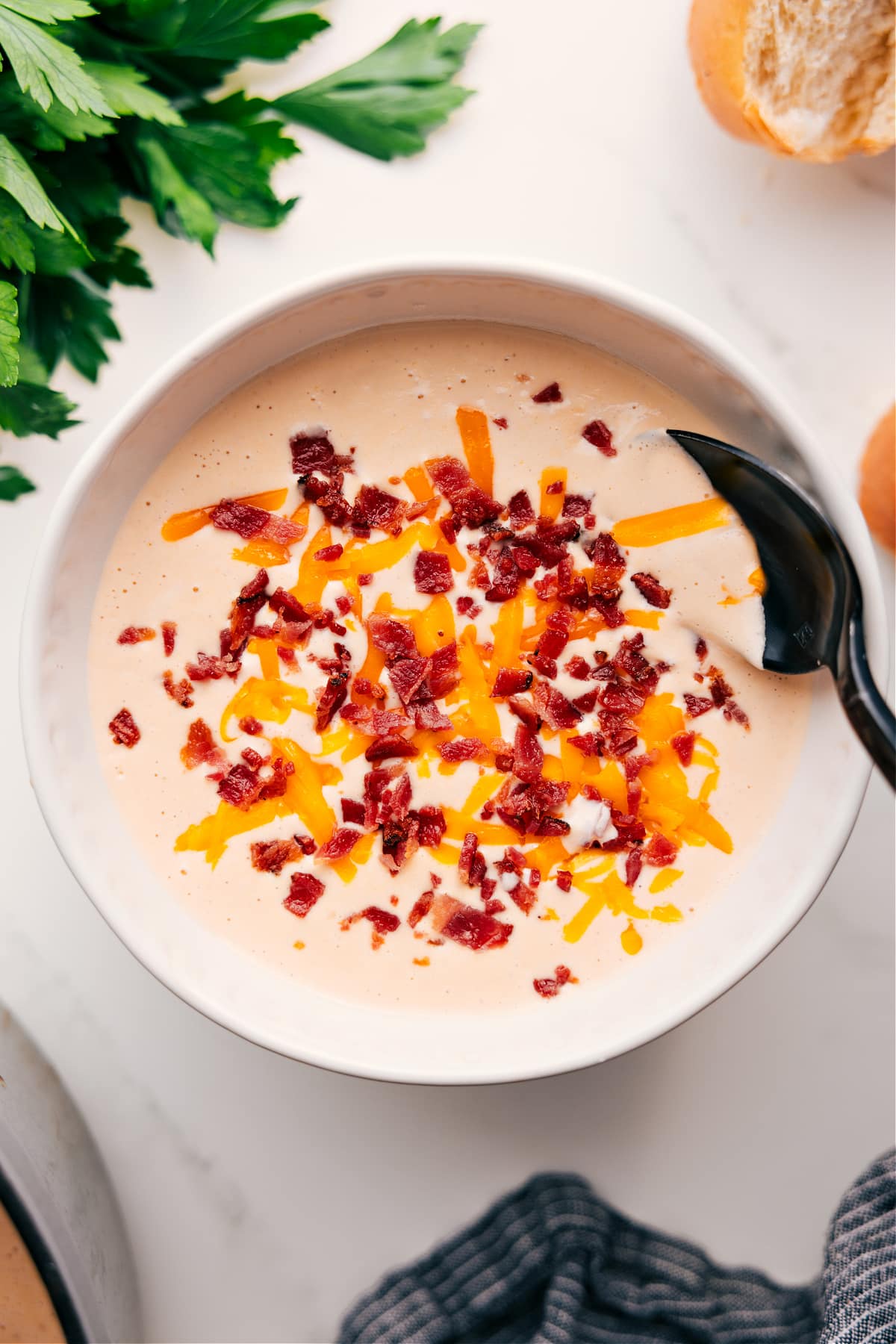 Cauliflower Soup Recipe In A Bowl Bowl of this creamy cauliflower soup recipe topped with shredded cheddar cheese and crispy bacon pieces.