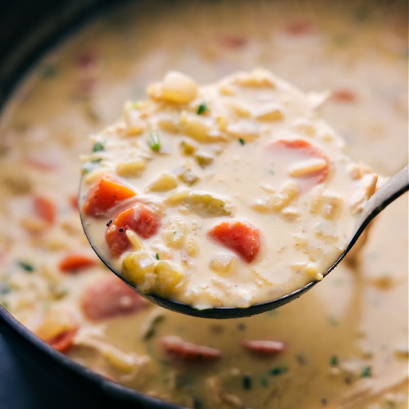 Image of a scoop of the Chicken Curry Rice Soup ready to be enjoyed