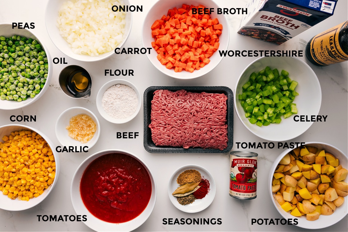 Ingredients In Vegetable Beef Soup Recipe All the ingredients in this dish prepped out for easy assembly including the peas, corn, tomatoes, garlic, oil, onion, carrot, flour, beef, seasonings, tomato paste, potatoes, celery, Worcestershire, and beef broth.