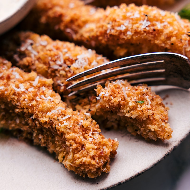 Image of a fork full being taken out of the baked cod