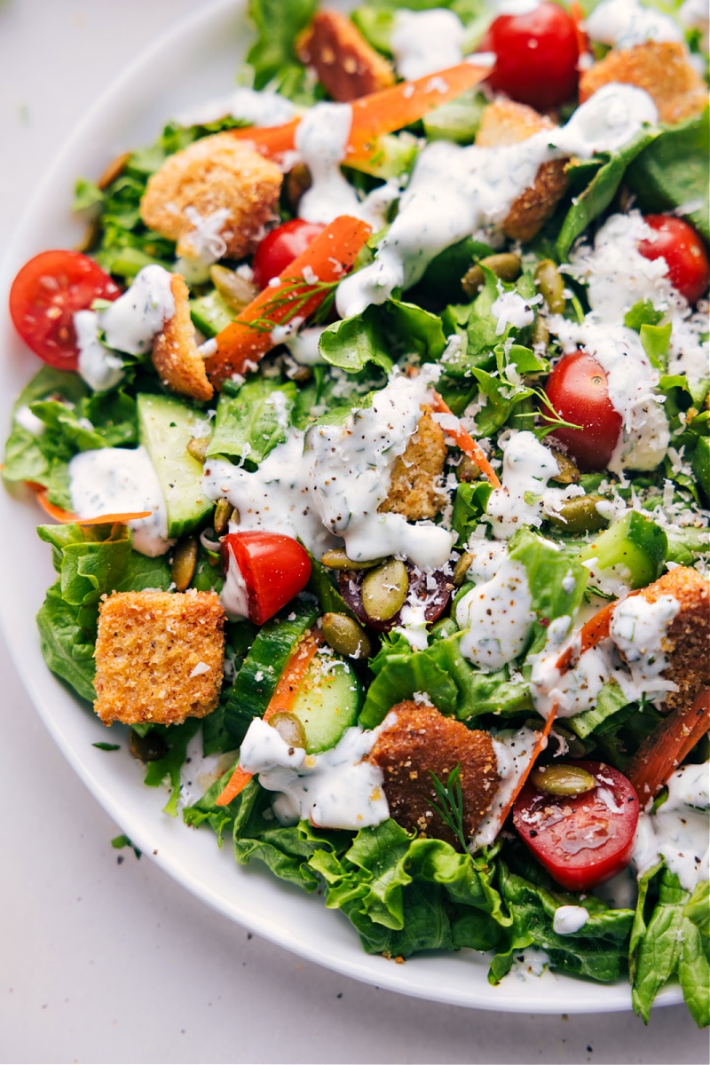 Up-close overhead image of a salad with Ranch Dressing on it