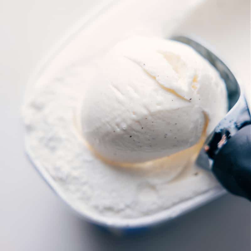 Image of a scoop of vanilla ice cream being taken out