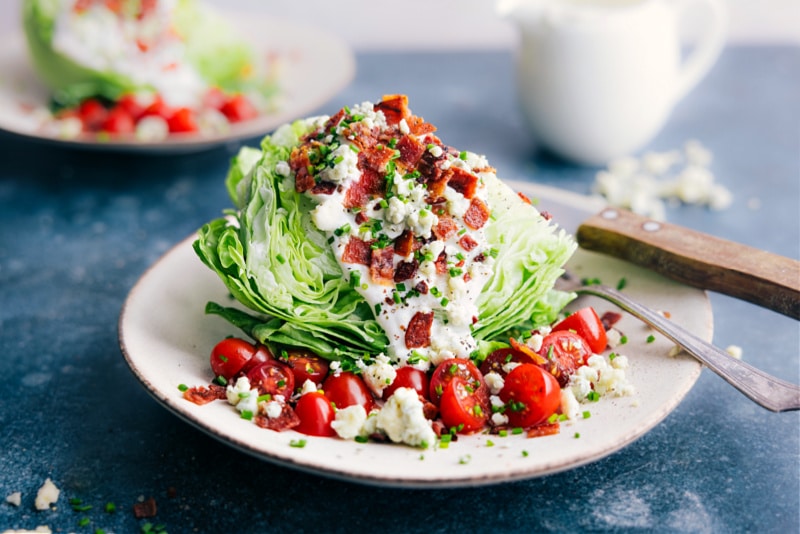 Image of the wedge salad with all the toppings ready to be enjoyed