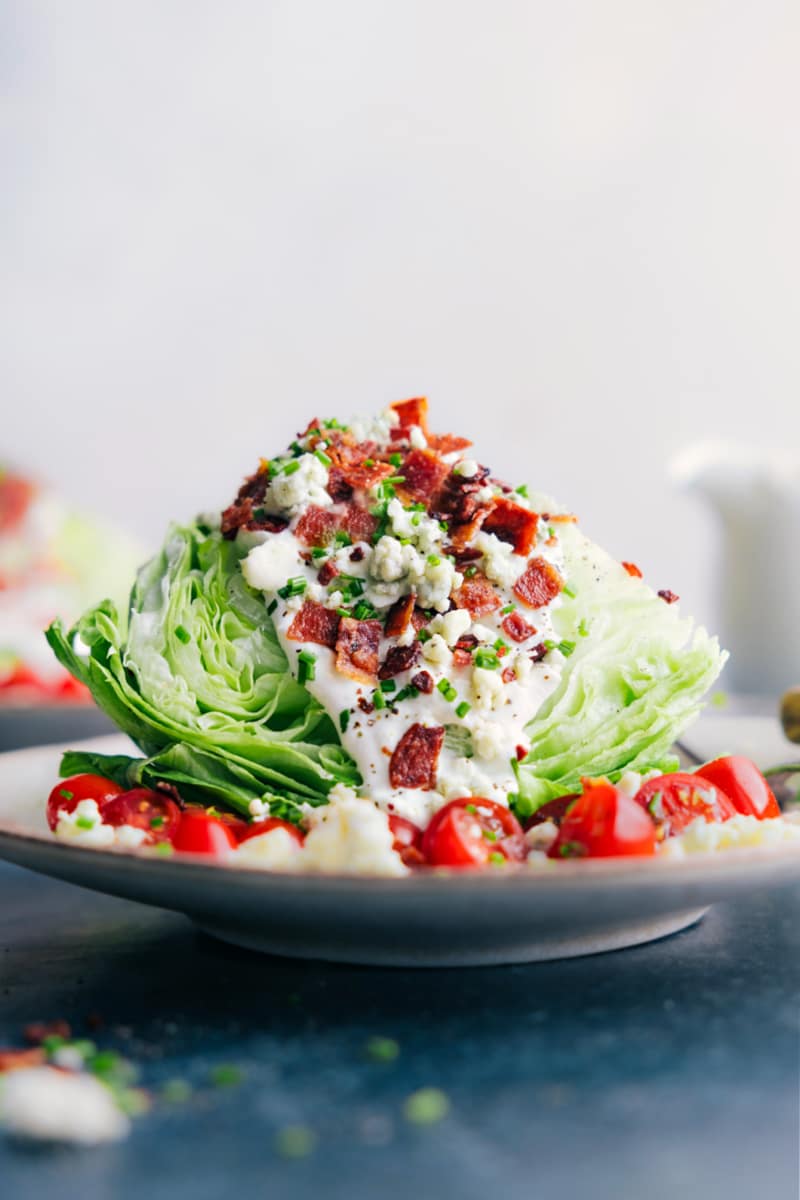 Image of the Blue Cheese Dressing poured over a wedge salad
