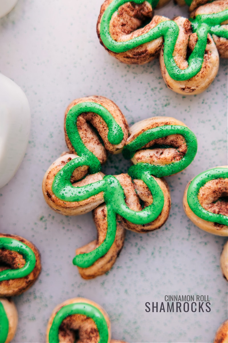 Overhead view of several iced Shamrock Cinnamon Rolls