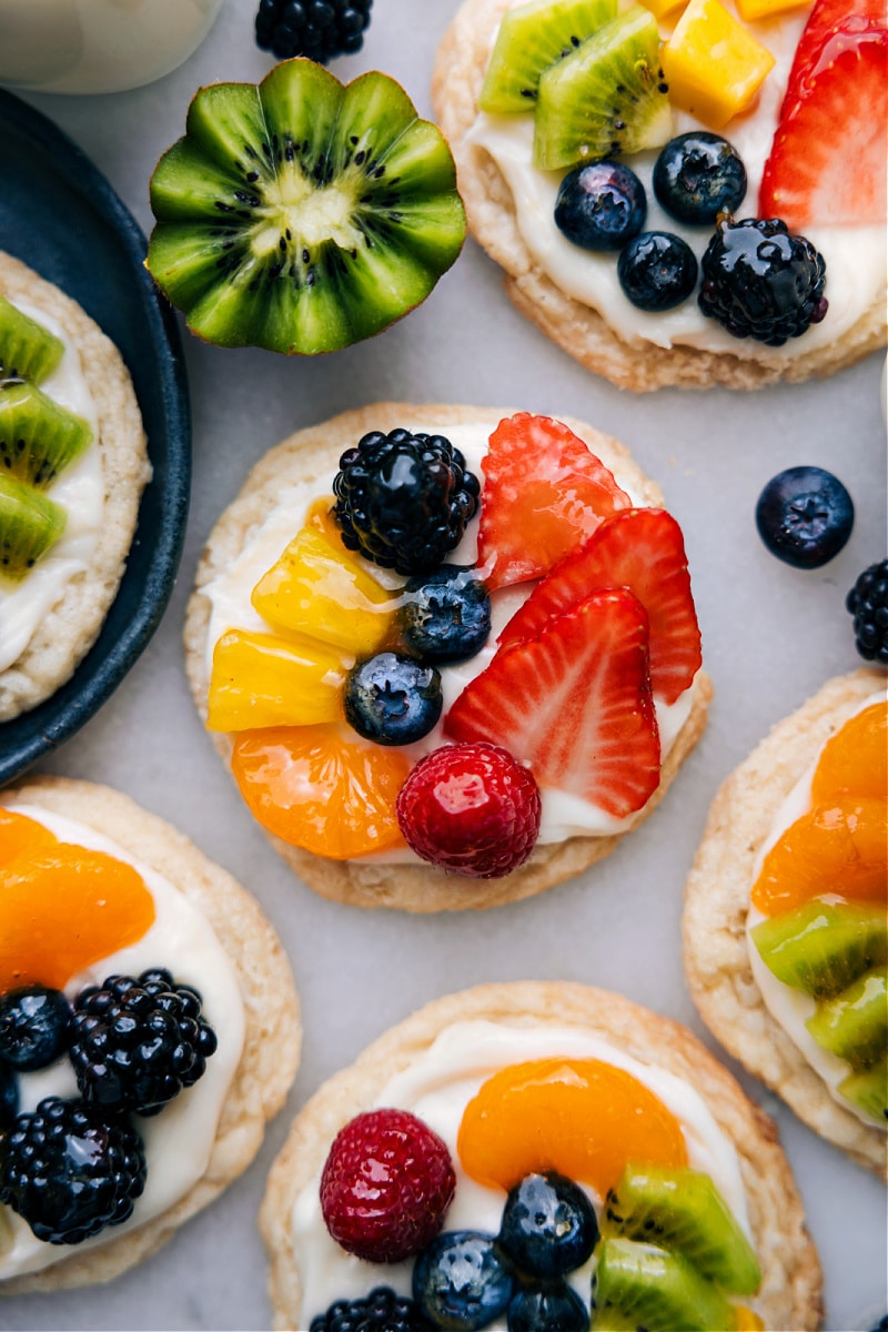 Overhead image of the sugar cookie fruit pizzas ready to be enjoyed