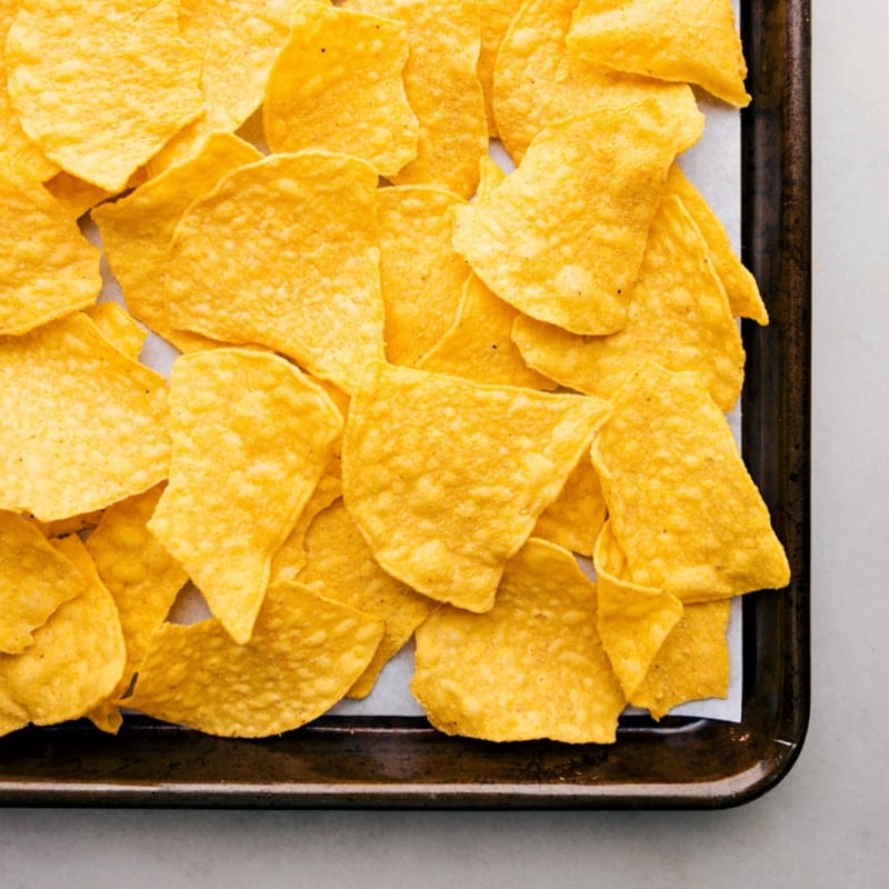 Overhead image of the chips being layered on the sheet pan