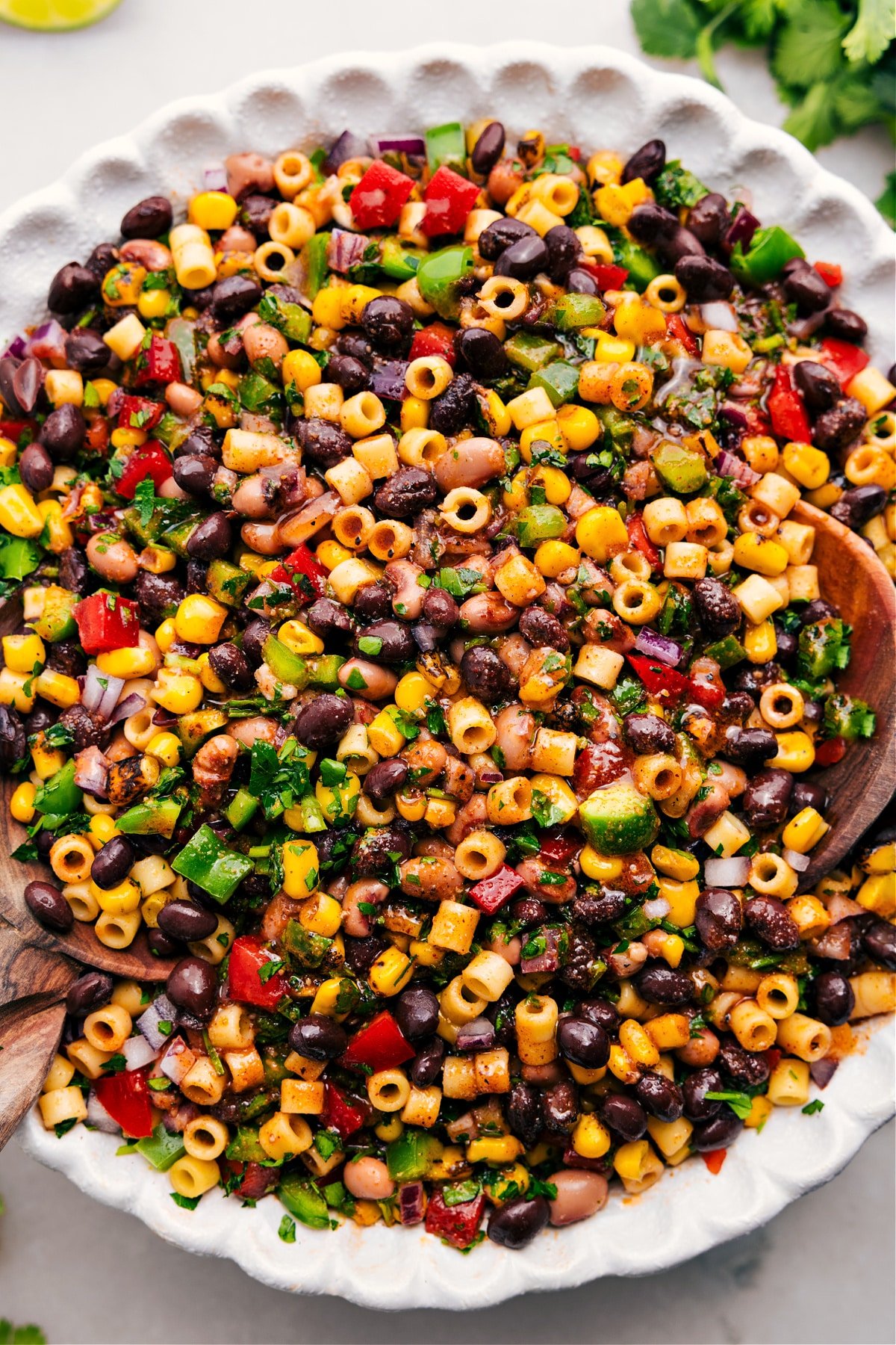 The Best Cowboy Caviar Recipe Cowboy Caviar Pasta Salad, dressed and tossed to perfection in a bowl.
