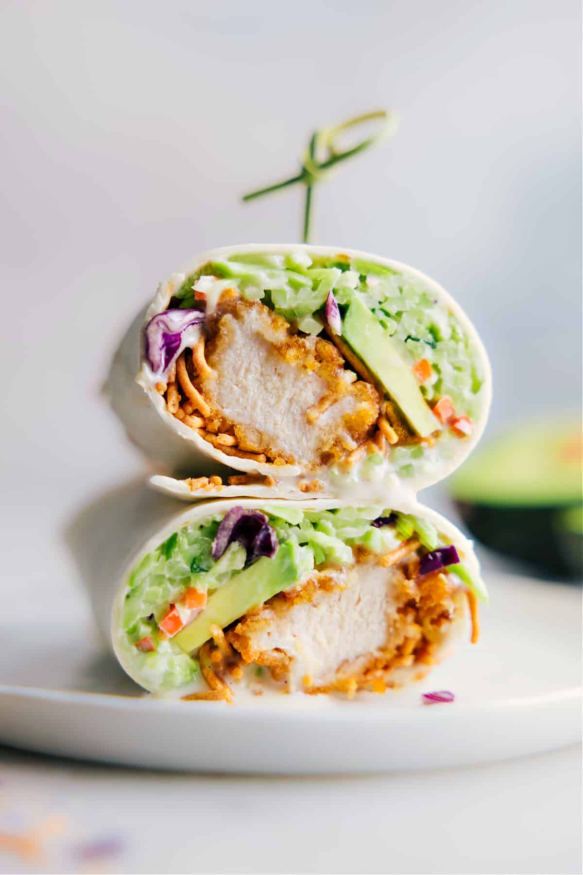 The Best Asian Chicken Wraps Asian Chicken Wraps stacked on top of each other.