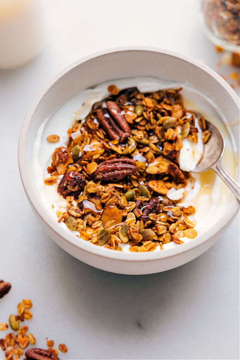 Overhead image of the Pumpkin Granola in a bowl with yogurt