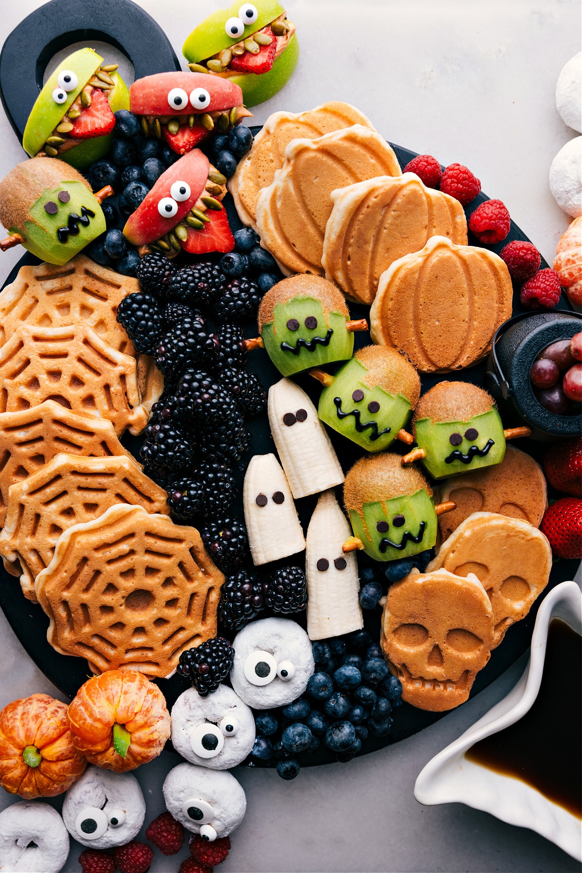 Display board showcasing a variety of Halloween-themed breakfast ideas.