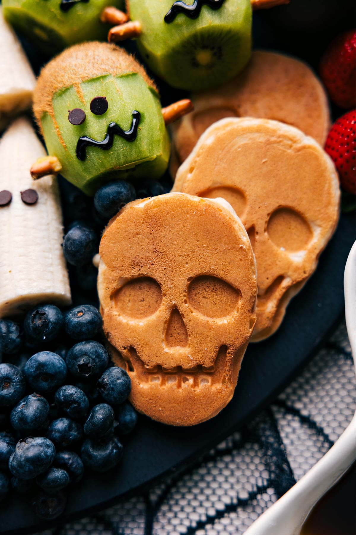 Pancakes shaped like skulls, cooked and ready to eat.