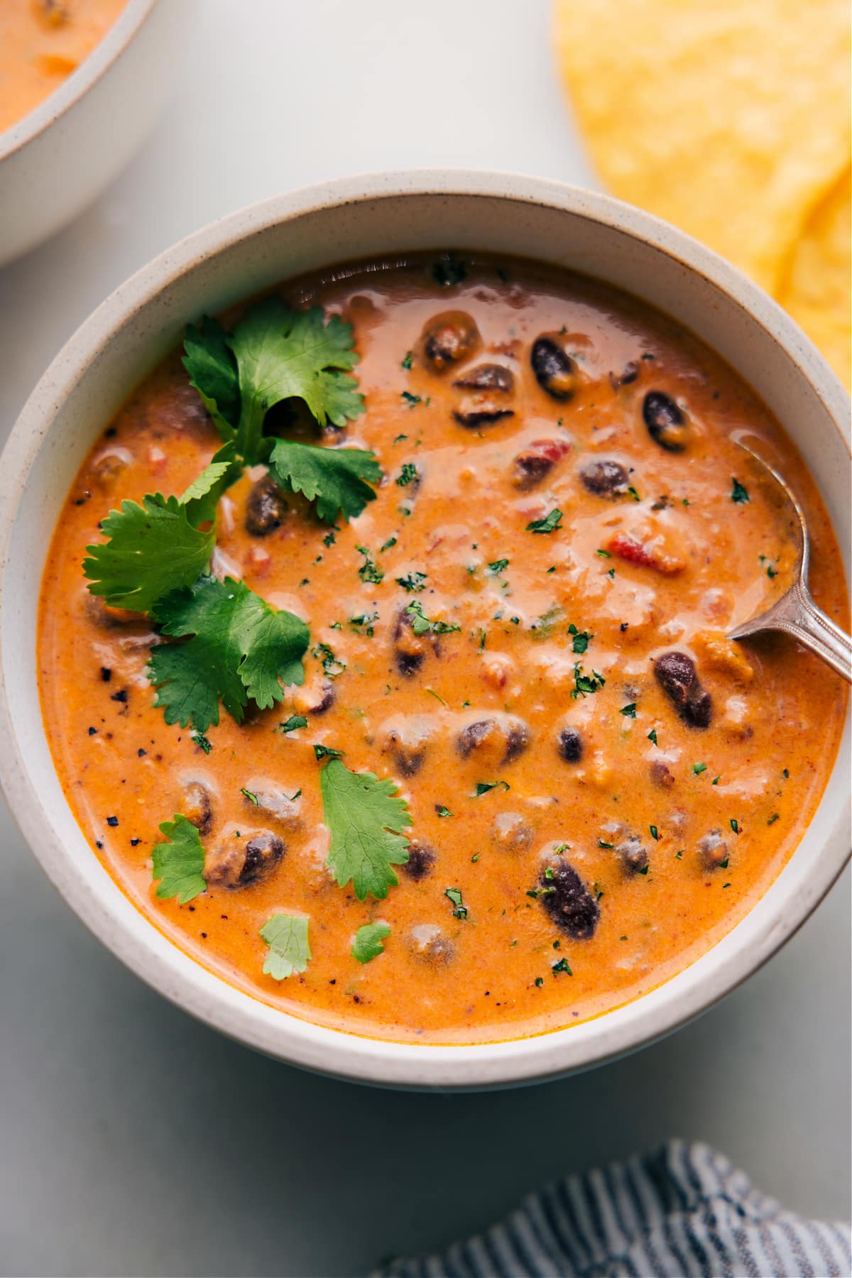 Overhead view of a bowl filled with Pumpkin Black Bean Soup, ready to be savored.