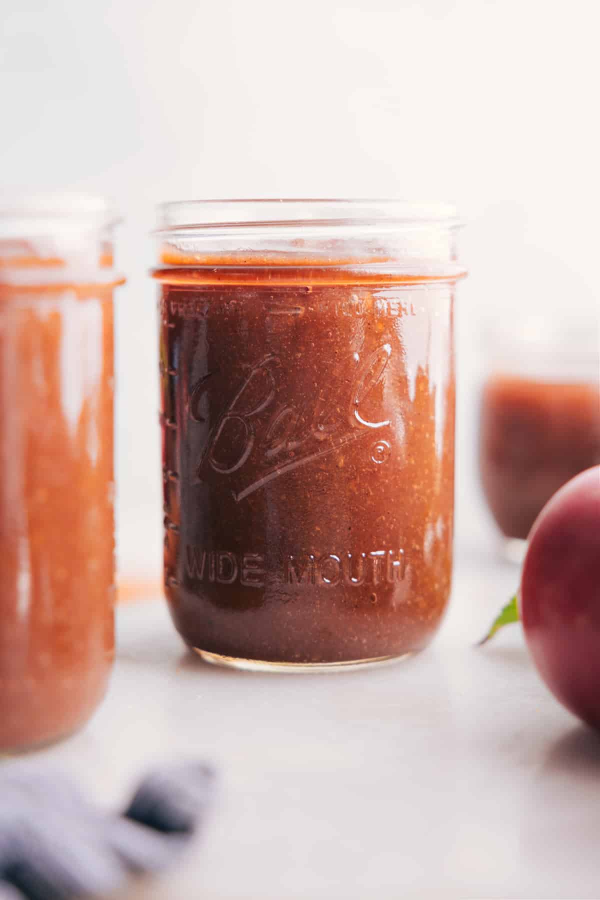 Glass jar filled with rich, smooth Apple Butter