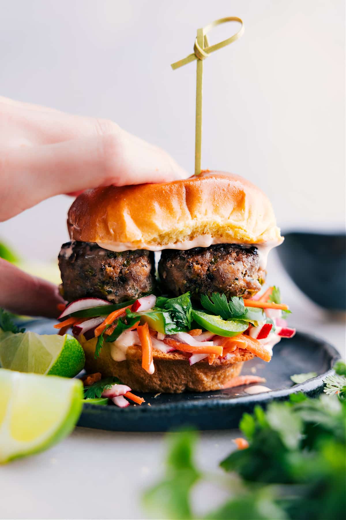 Completed slider, a visual feast showcasing layers of delicious ingredients including the banh mi meatballs, ready to be relished.