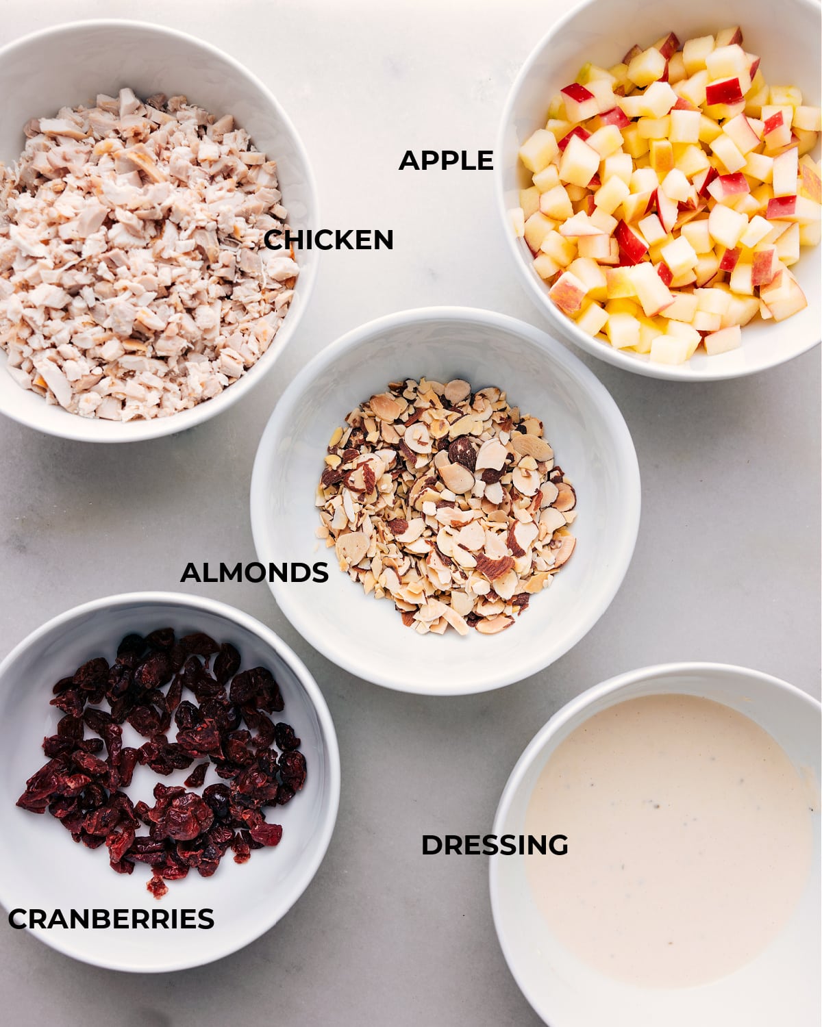 Assorted ingredients for a recipe displayed on a board, ready for preparation.