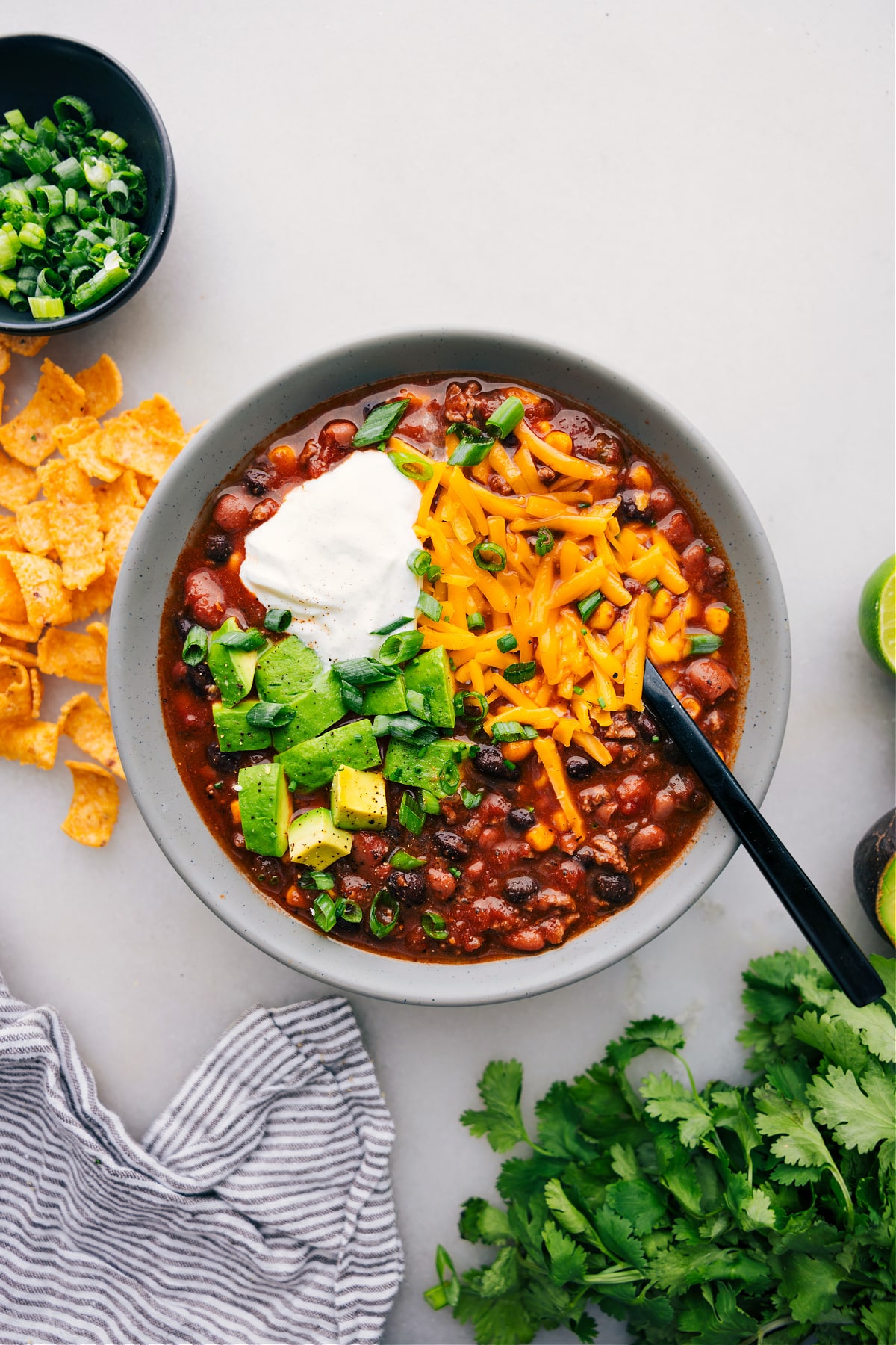 A bowl of Taco Soup with various toppings adds a burst of flavor and texture to this delicious dish.