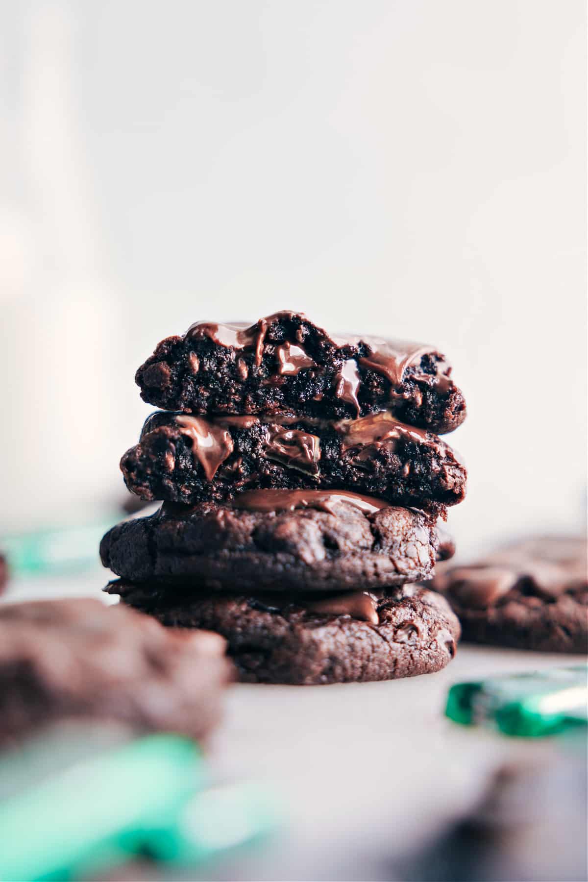 A stack of delicious andes mint cookies with chocolate dripping down, creating a mouth-watering dessert.