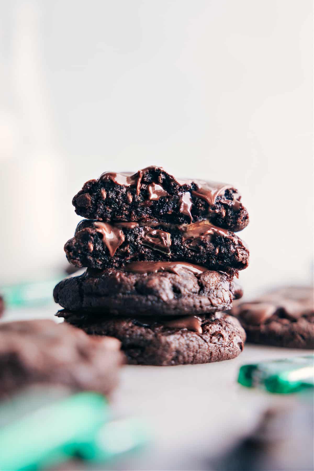 Andes Mint Cookies with Chocolate Frosting - Sweet Delight A stack of delicious andes mint cookies with chocolate dripping down, creating a mouth-watering dessert.