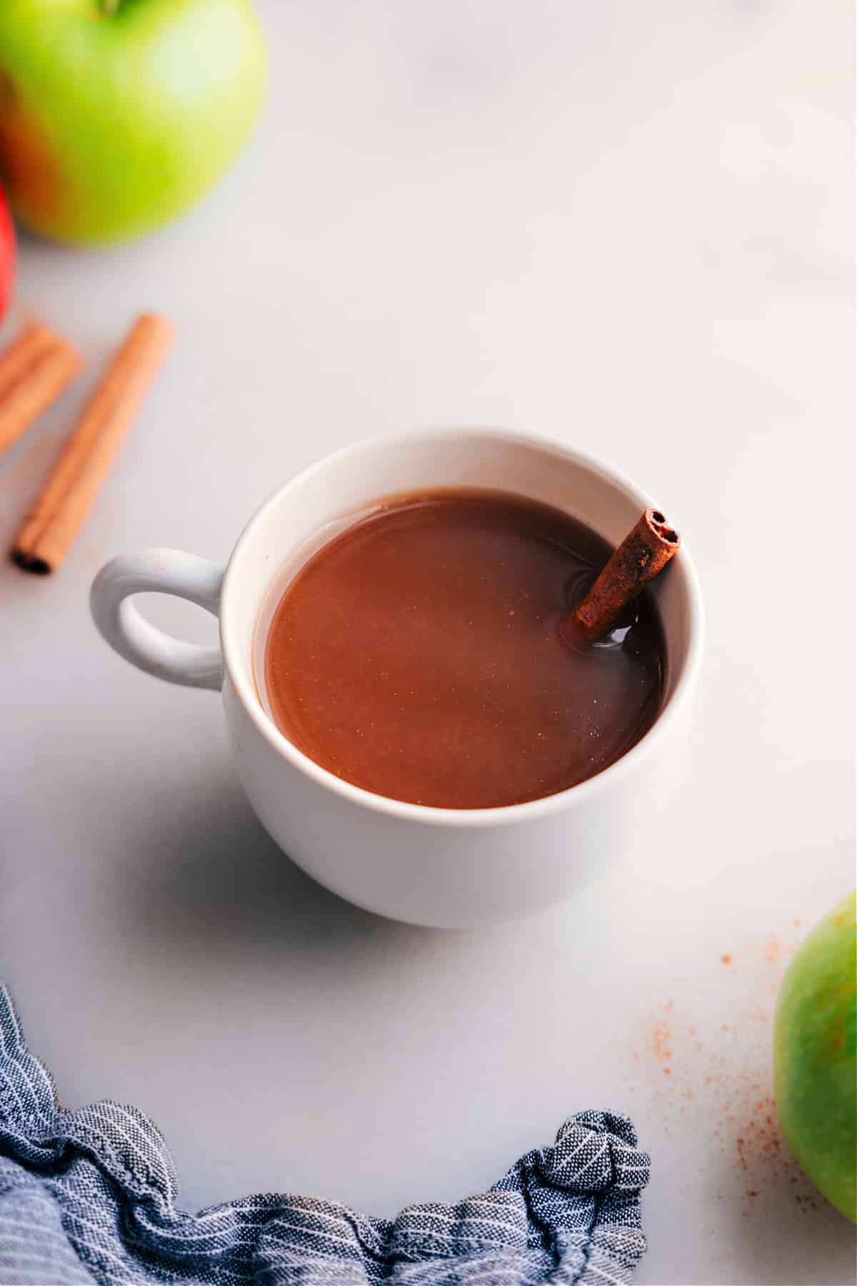 Warm and Inviting Apple Cider in a Cozy Mug A steaming cup of delicious Apple Cider.