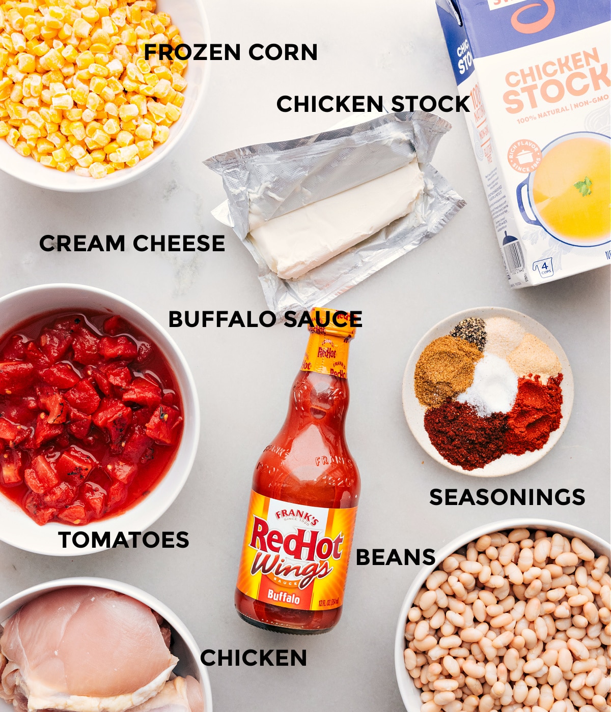 Ingredients used in this dish, including hot sauce, corn, beans, tomatoes, chicken stock, and chicken.