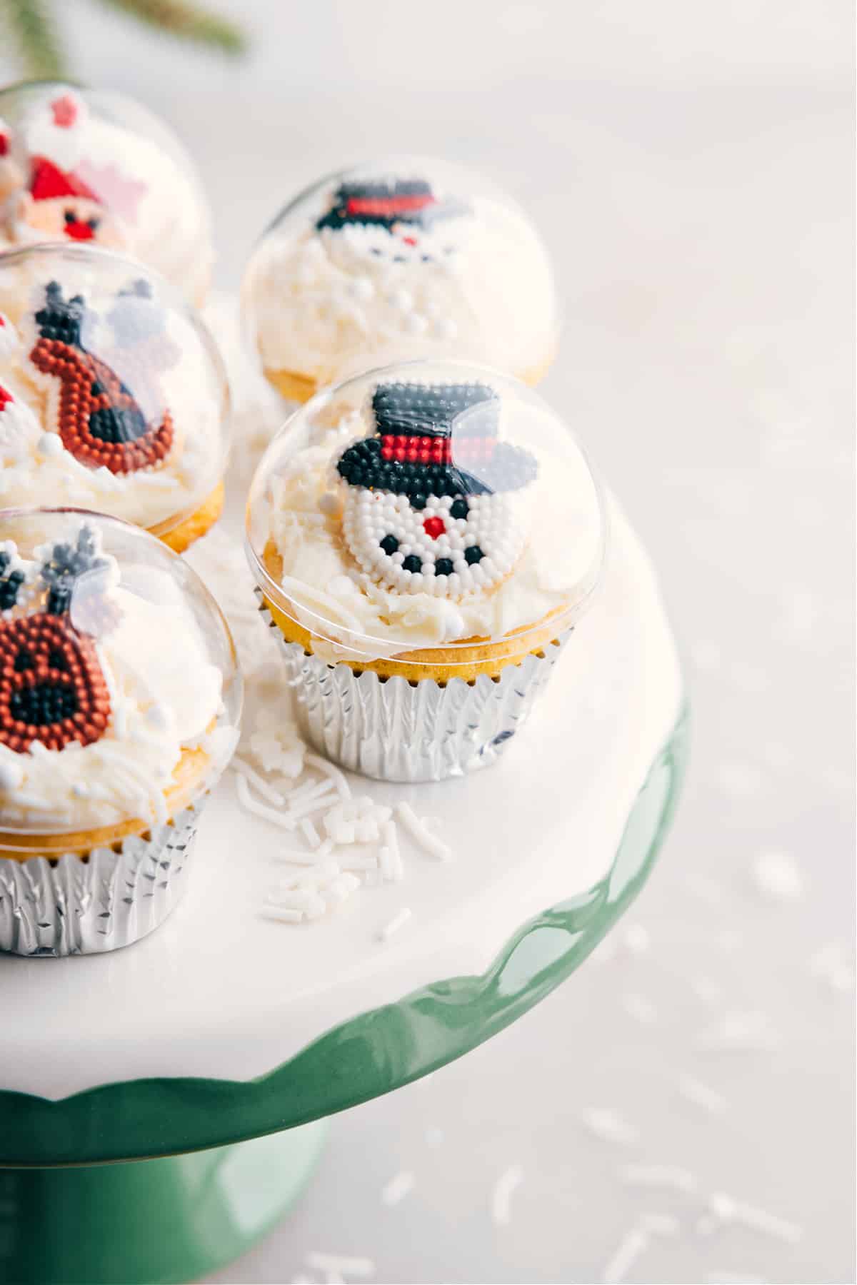 A collection of adorable christmas cupcake ideas, showcasing a variety of festive designs and decorations.