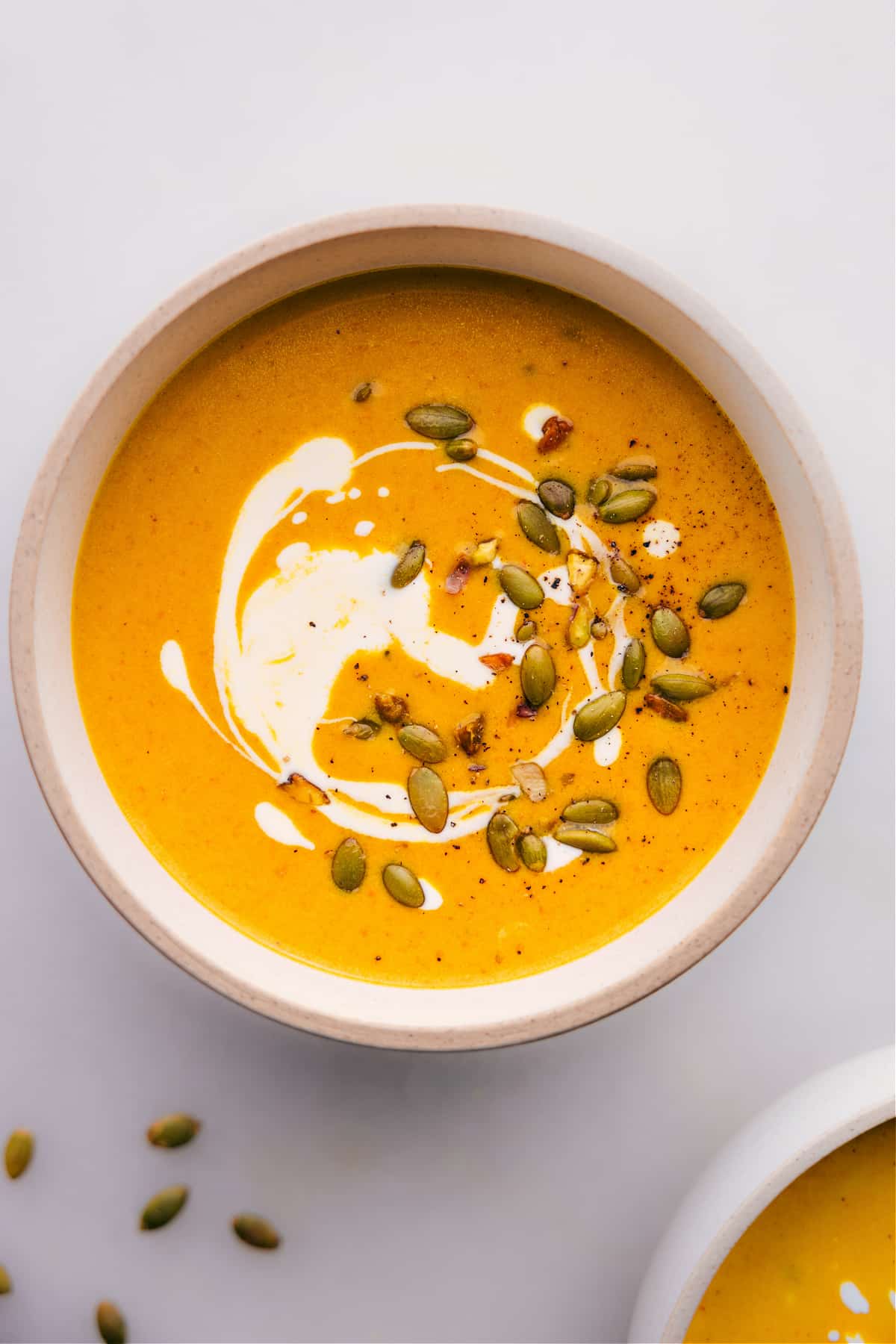 A bowl of pumpkin curry soup ready to be enjoyed.