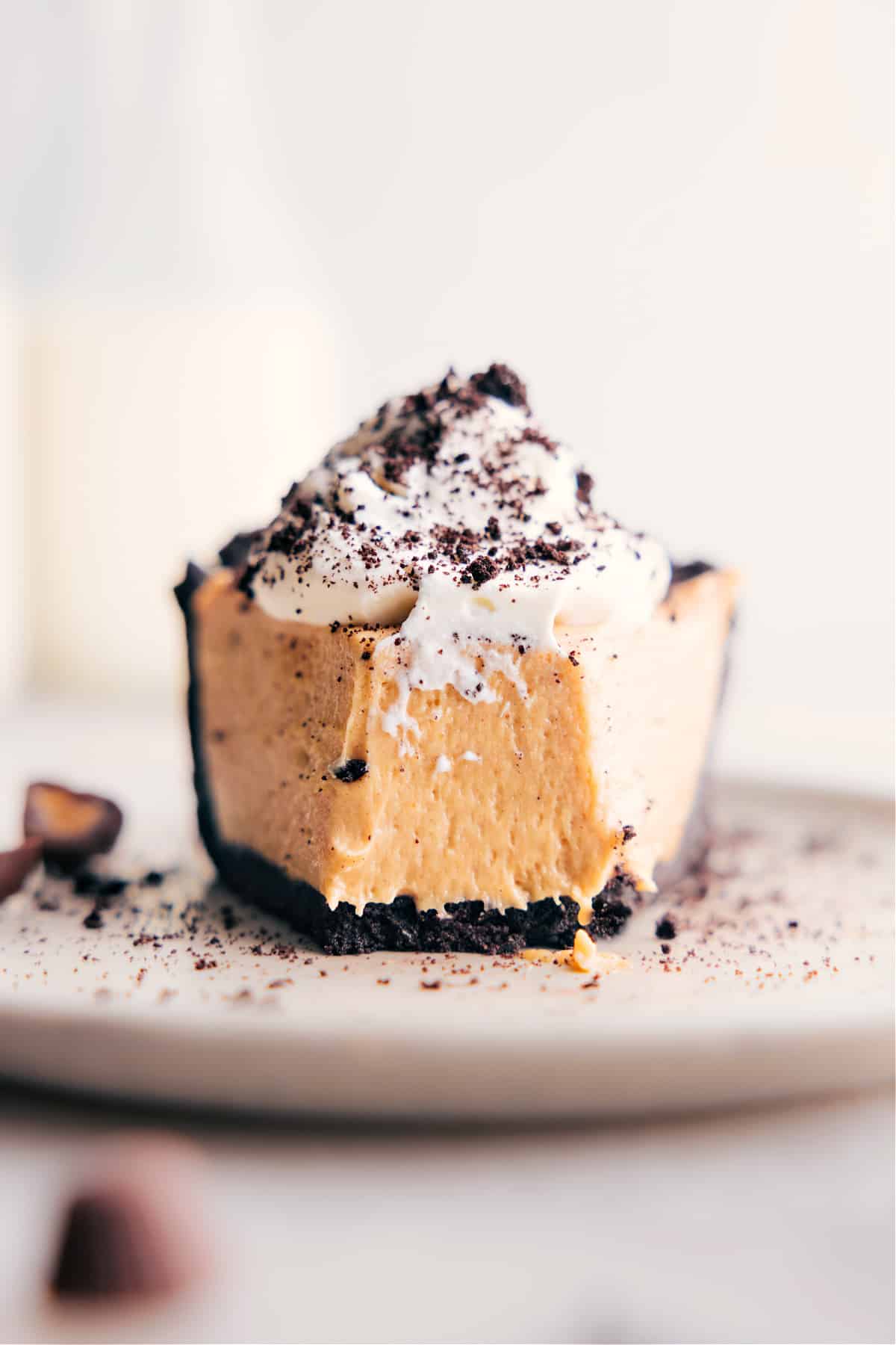 Slice of Peanut Butter Pie with a bite out of it.