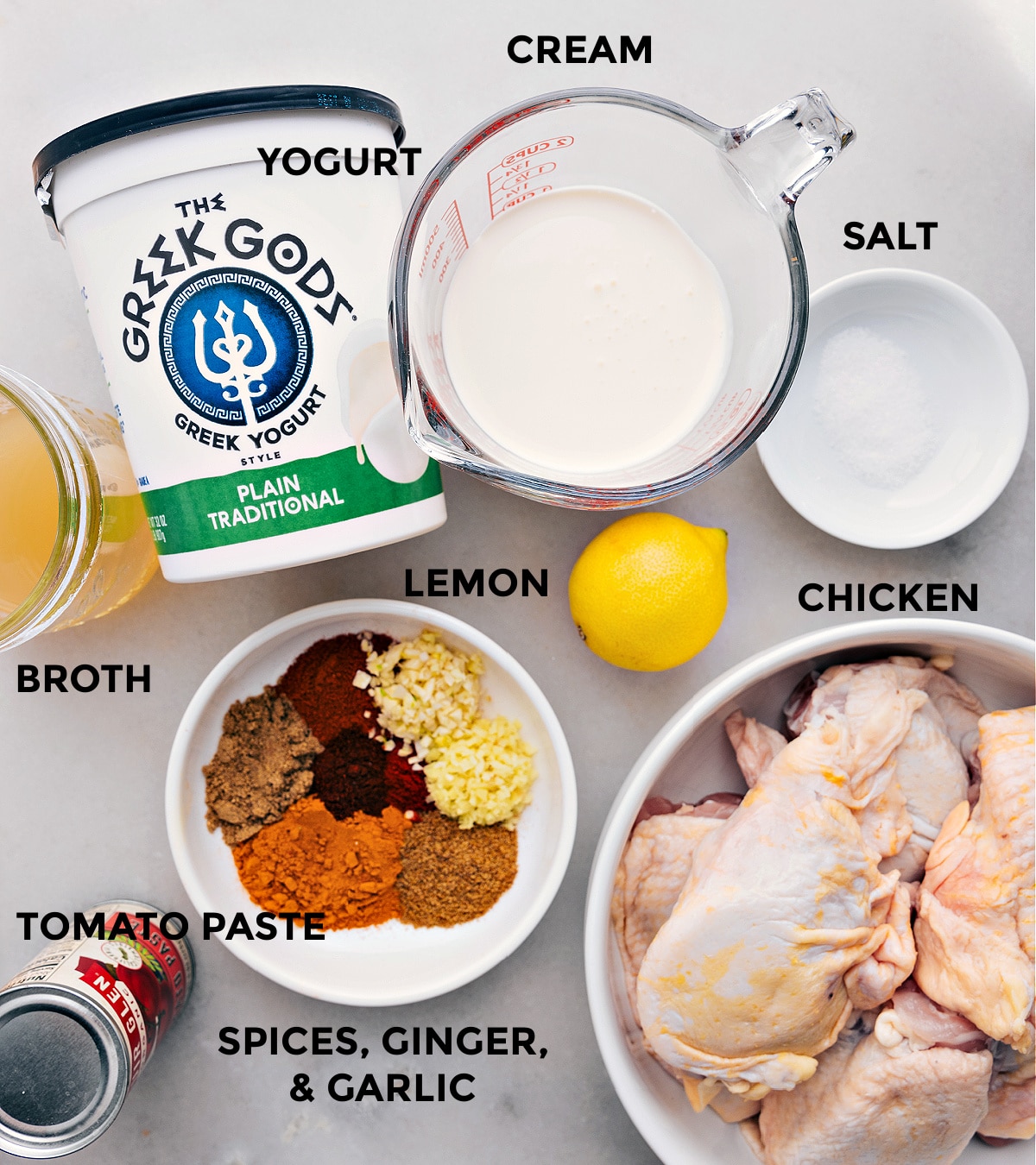 Ingredients used for the recipe including chicken, spices, yogurt, cream, and more.
