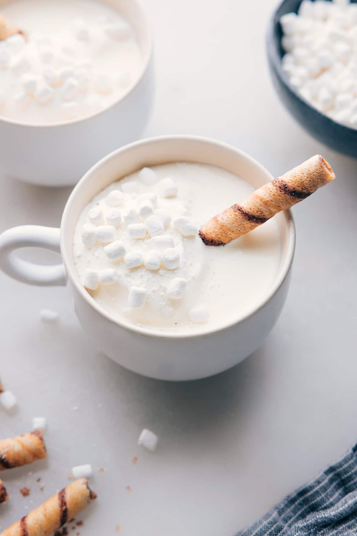 The finished White Hot Chocolate beverage in a mug, topped with mini marshmallows, a delicious and beautiful drink ready for enjoyment on a cold day.