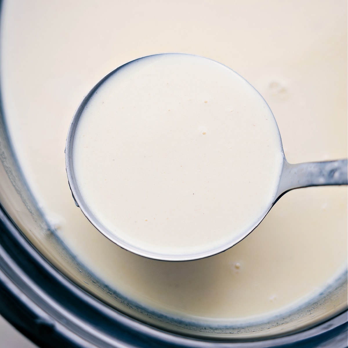 A ladle full of the warm and freshly prepared beverage, ready to be served and enjoyed.