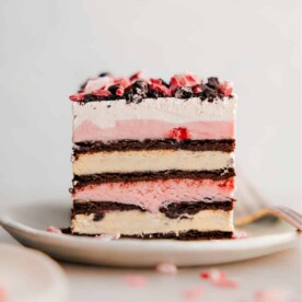 A slice of 3 ingredient peppermint ice cream bars, elegantly plated to showcase its delicious layers, inviting a delightful dessert experience.