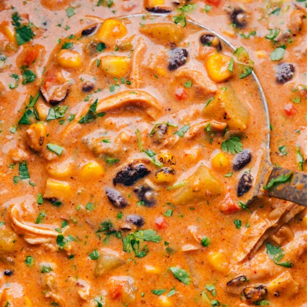 A warm pot of hearty southwestern corn chowder, ready to be enjoyed, with visible ingredients like corn, peppers, and herbs.