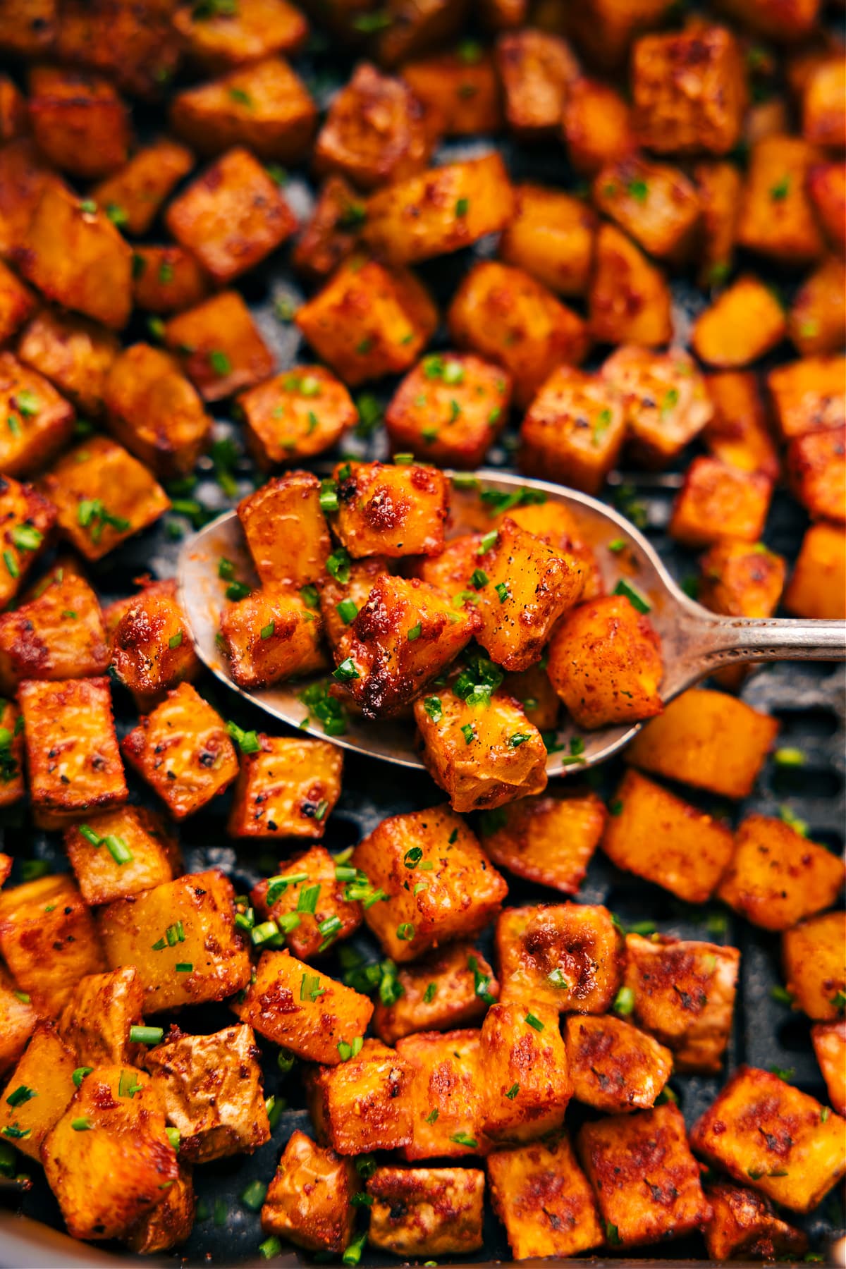 The freshly cooked breakfast potatoes ready to be served.