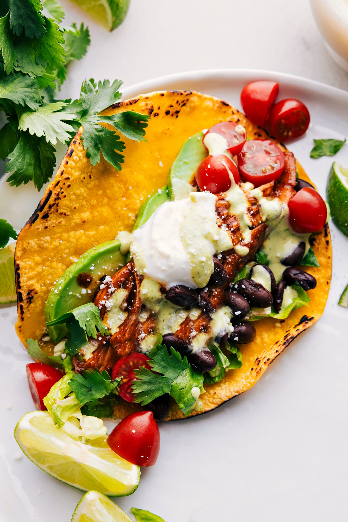 Crockpot Chicken Tacos Image of fully assembled Crockpot Chicken Tacos ready to be enjoyed.
