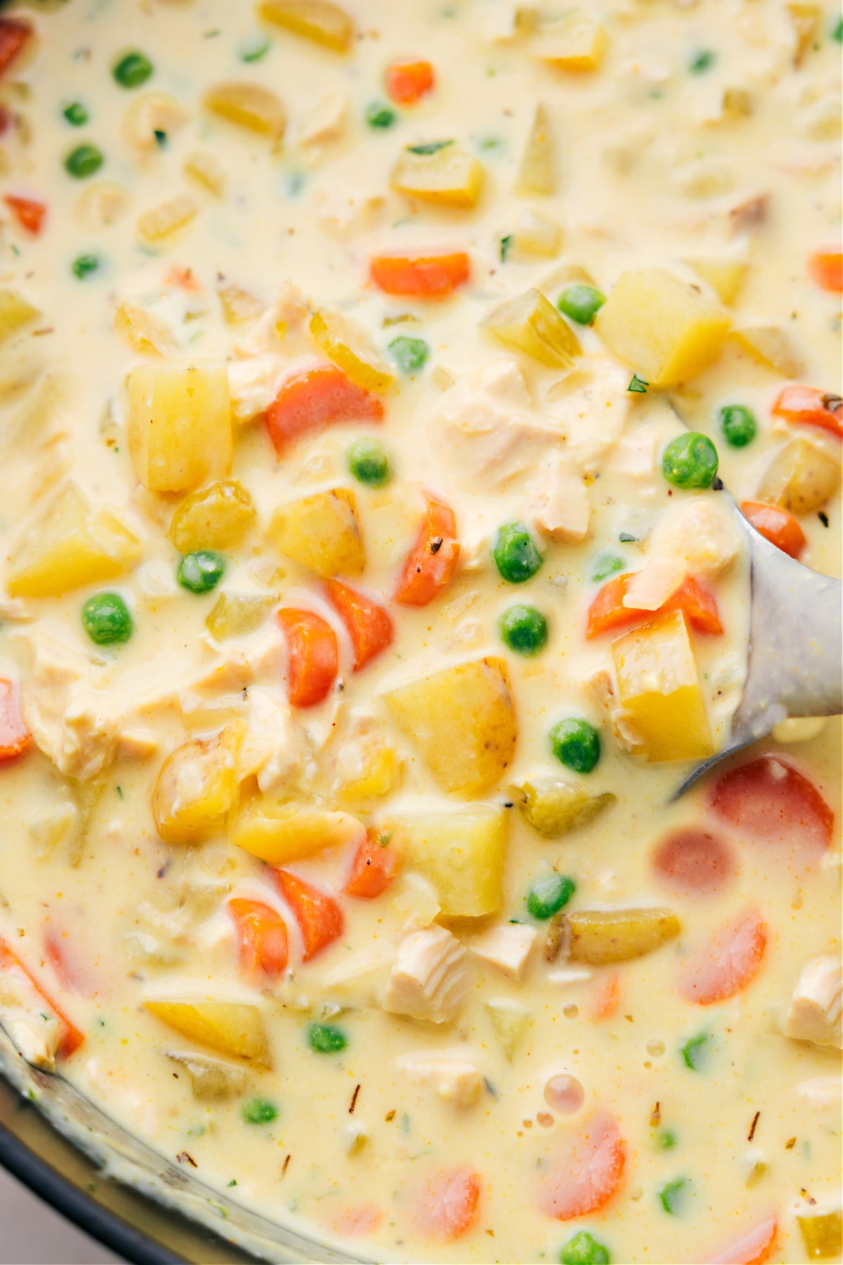 The finished warm and delicious curry chicken chowder, packed full of flavor, vegetables, and chicken, creating the perfect meal.