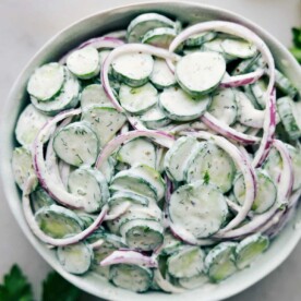 Creamy cucumber salad recipe in a bowl ready to be served.
