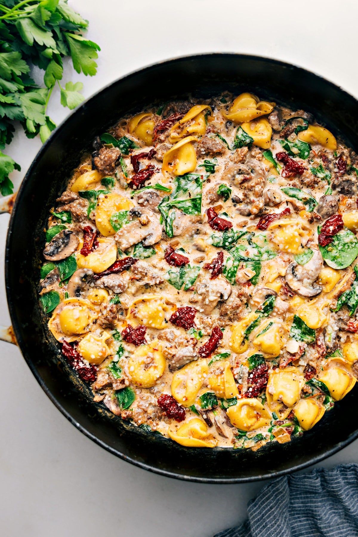 Sausage Tortellini Bake Tortellini bake with sausage, cheese tortellini, creamy sauce, and melted cheese.
