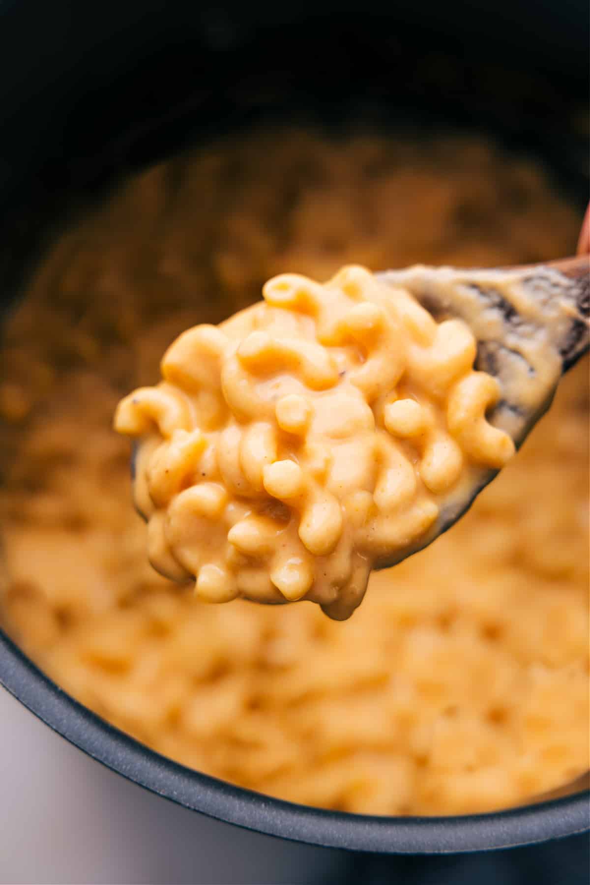 Mac and cheese with a scoop being scooped out.