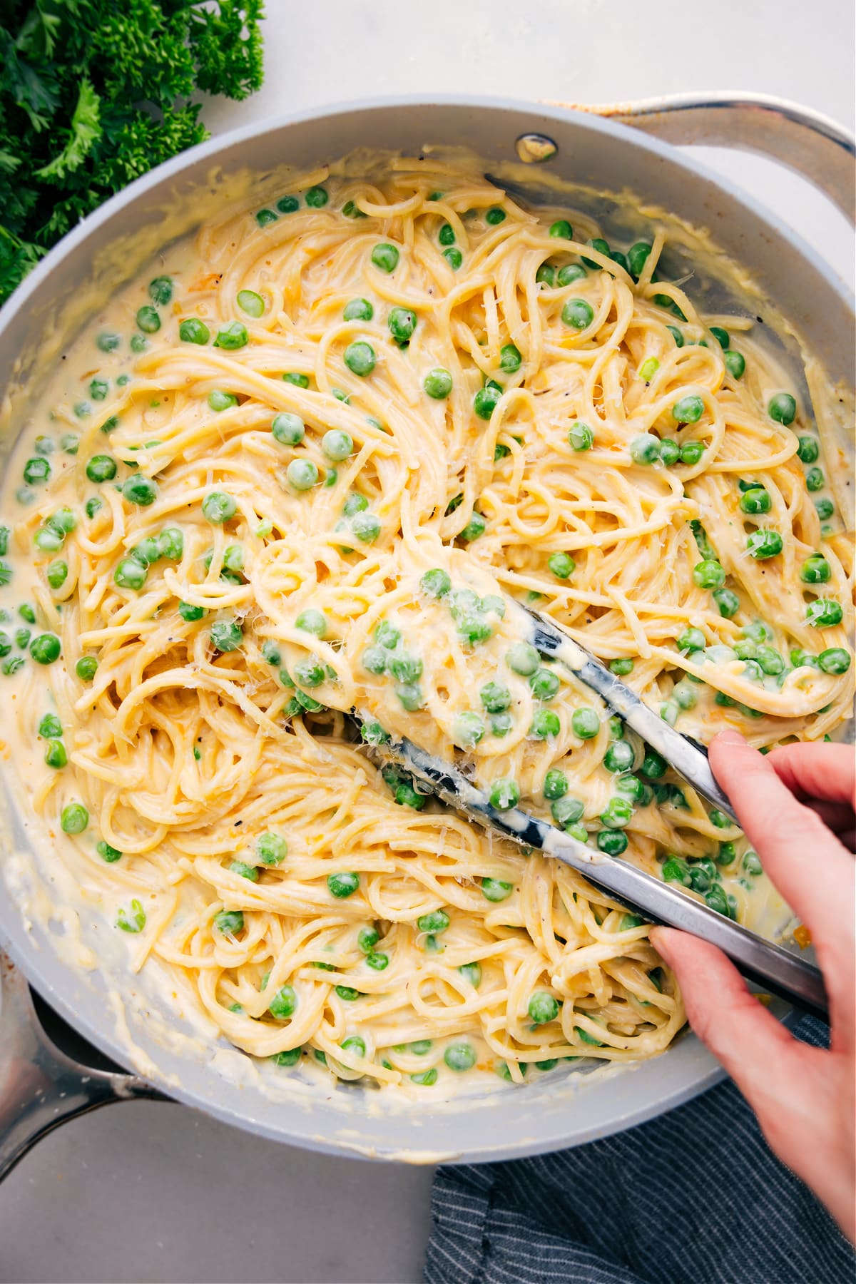 The Best And Easiest Cheesy Spaghetti Recipe Cheesy Spaghetti in a pot with a scoop ready to enjoy.