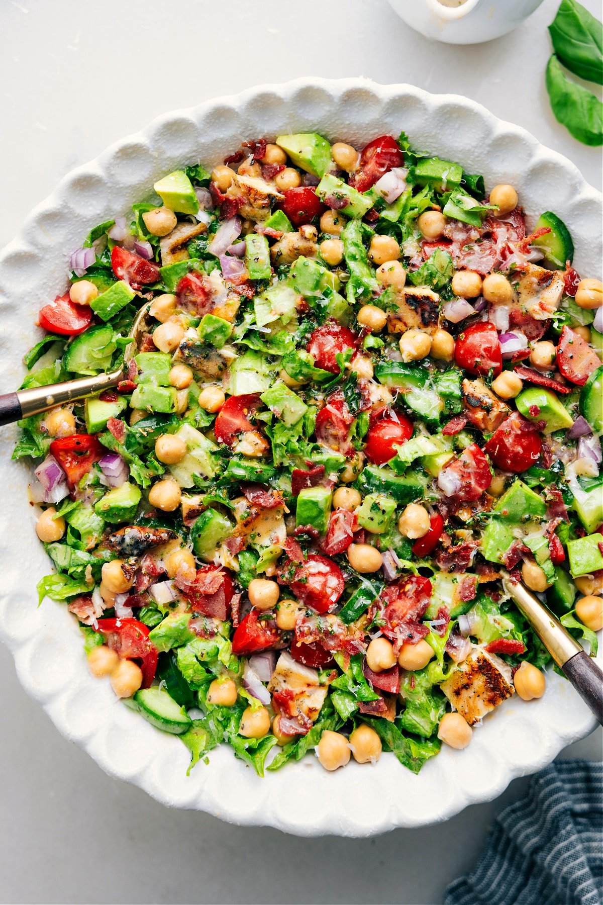 The Best Chopped Chicken Salad Chopped Chicken Salad mixed in a bowl with dressing.