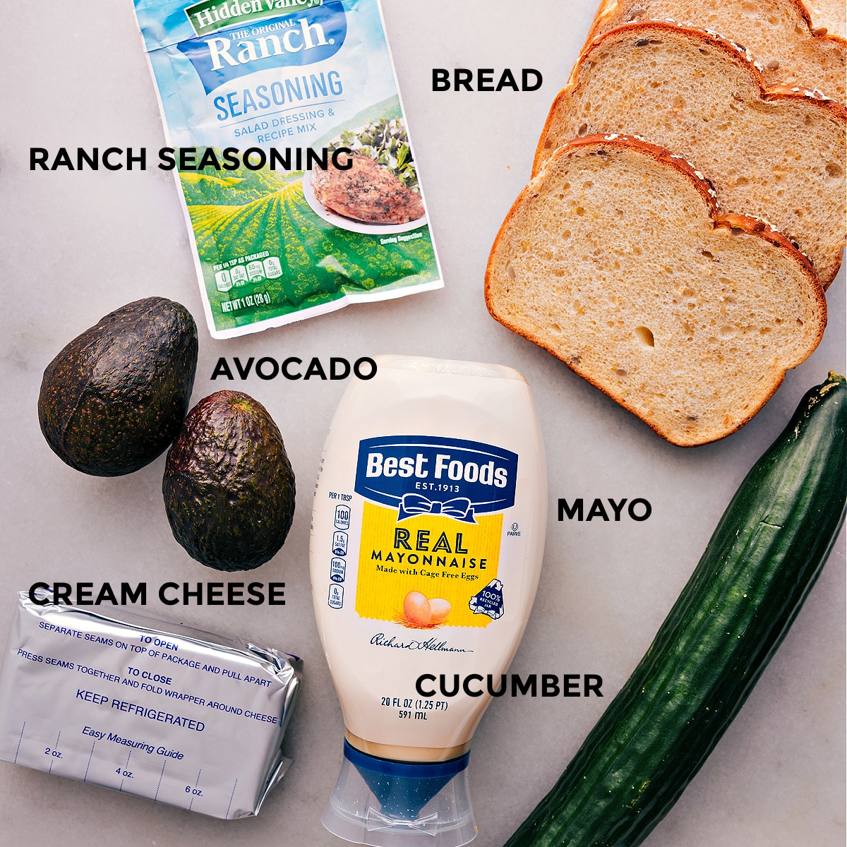 All the ingredients in this recipe are prepped for easy assembly, including bread, ranch seasoning, veggies, mayo, and cream cheese.