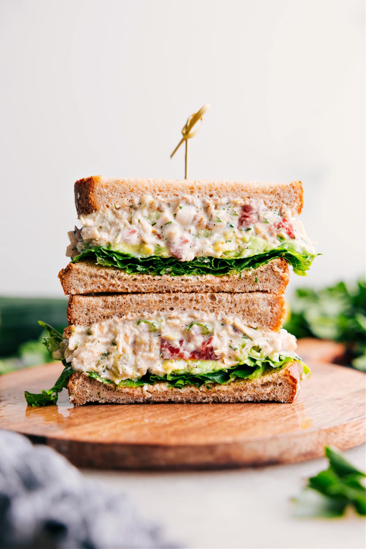 Simple And Delicious BLT Chicken Salad BLT Chicken Salad stacked in a sandwich, showcasing the yummy inside.