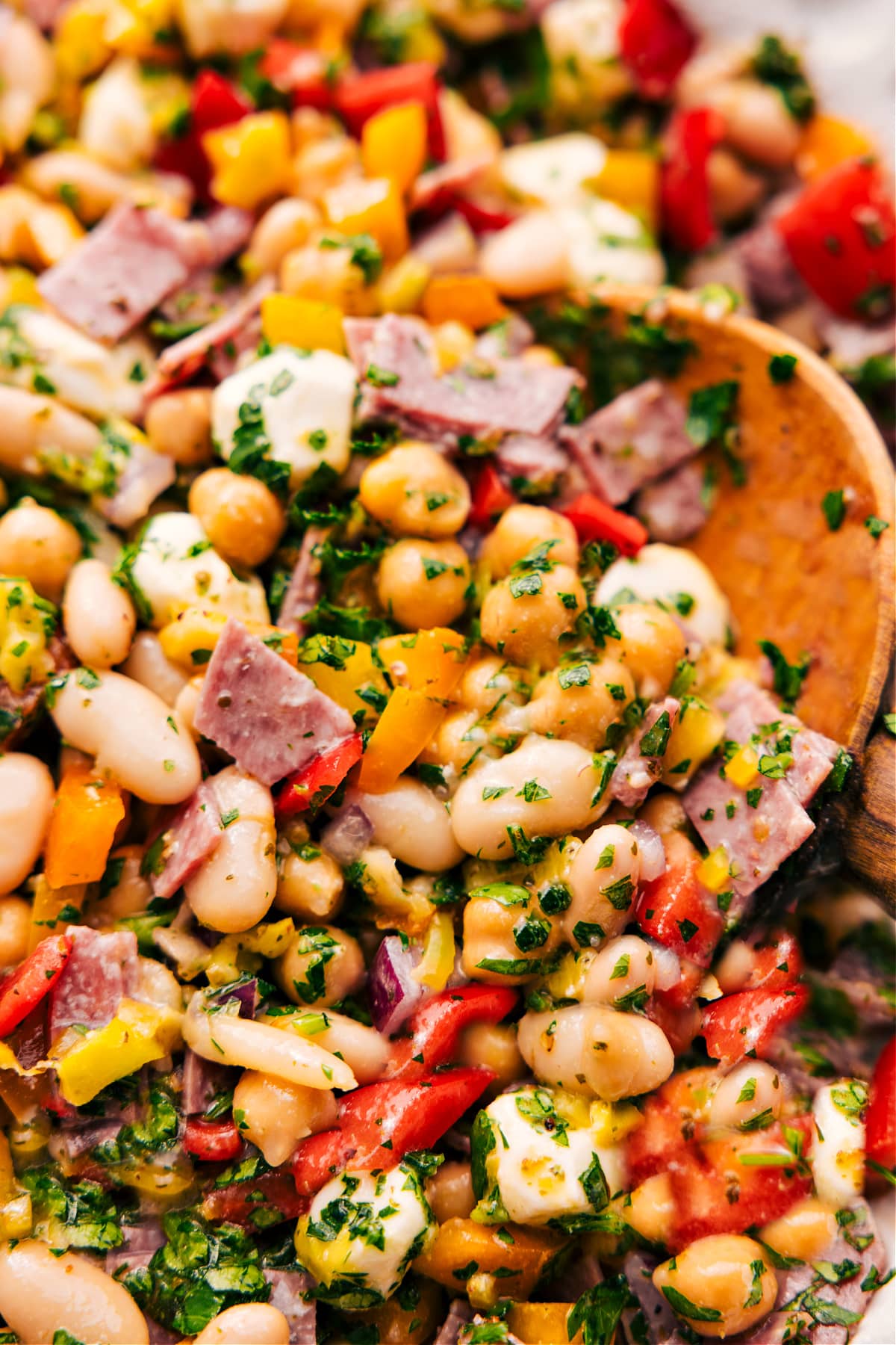 Dense bean salad in a bowl dressed.
