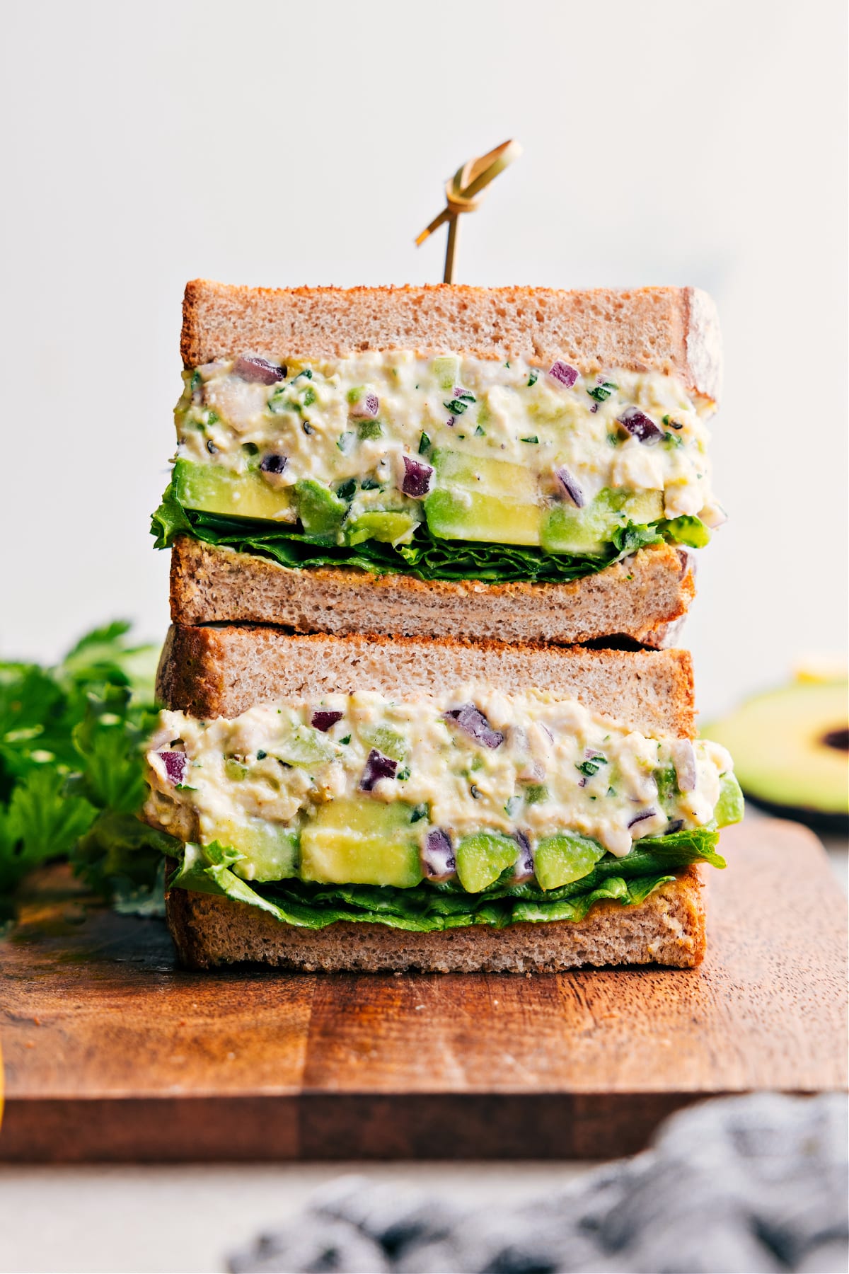 Chicken Avocado Sandwich, sliced in half and stacked to show off the delicious filling.