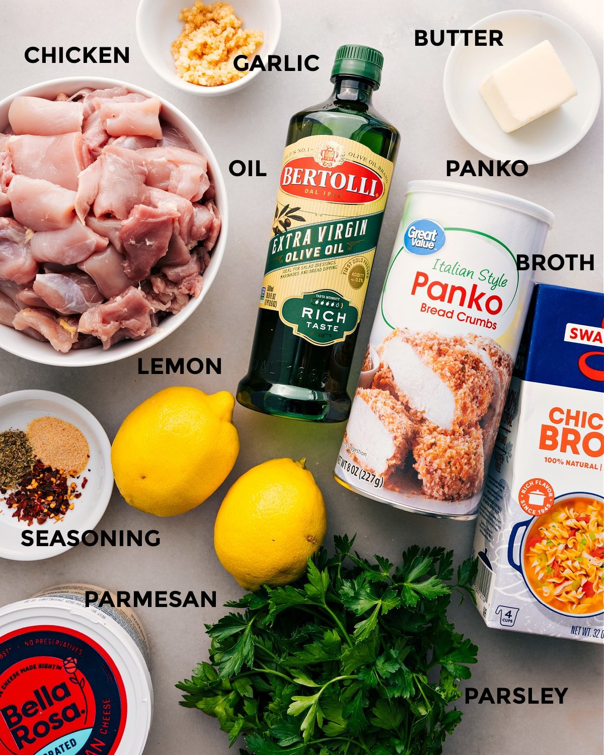 All the ingredients are prepped for easy assembly—meat, oil, panko, butter, garlic, broth, lemon, seasoning, parmesan, and parsley.