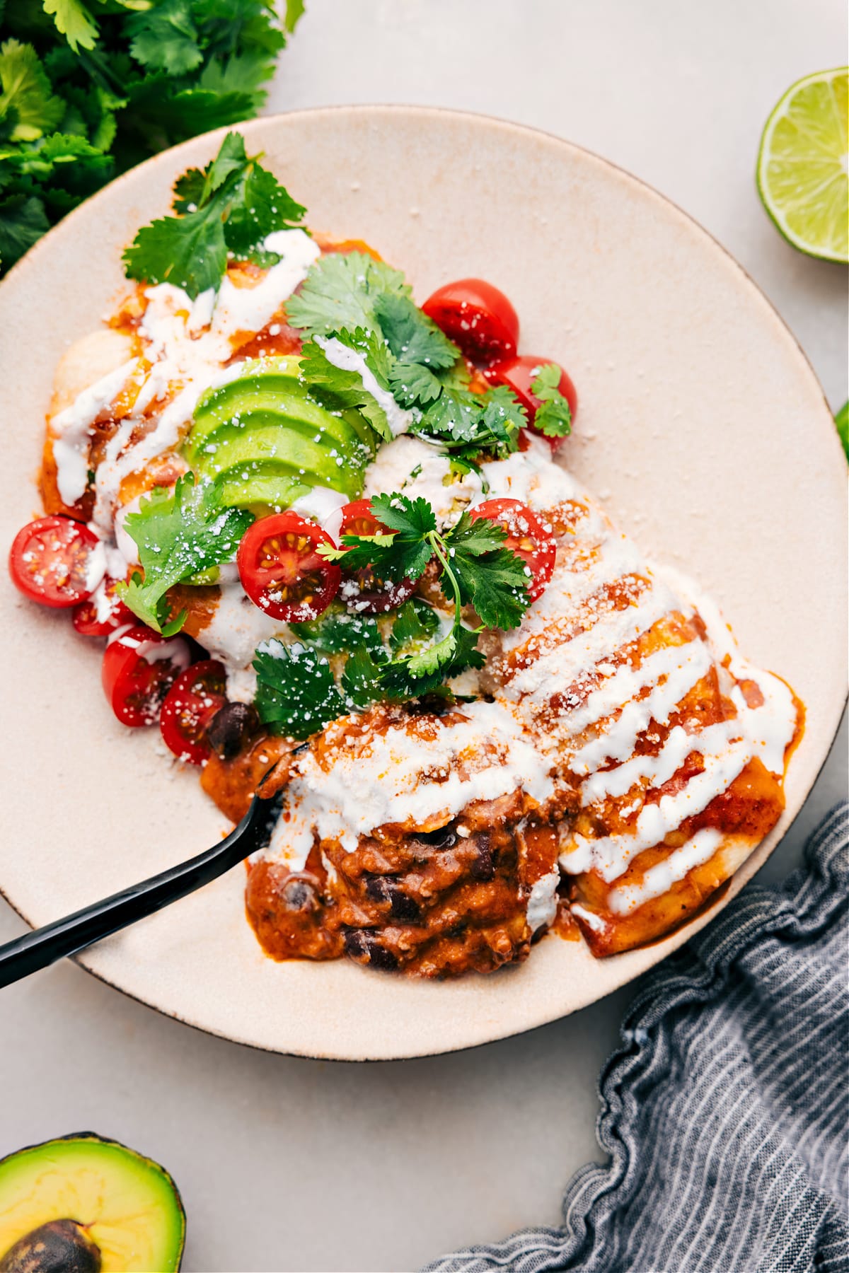 Ground Beef Enchiladas on a plate, ready to serve.